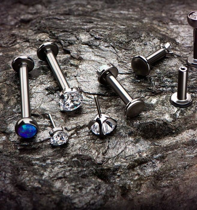 A tray of premium implant-grade and 14K gold body jewelry